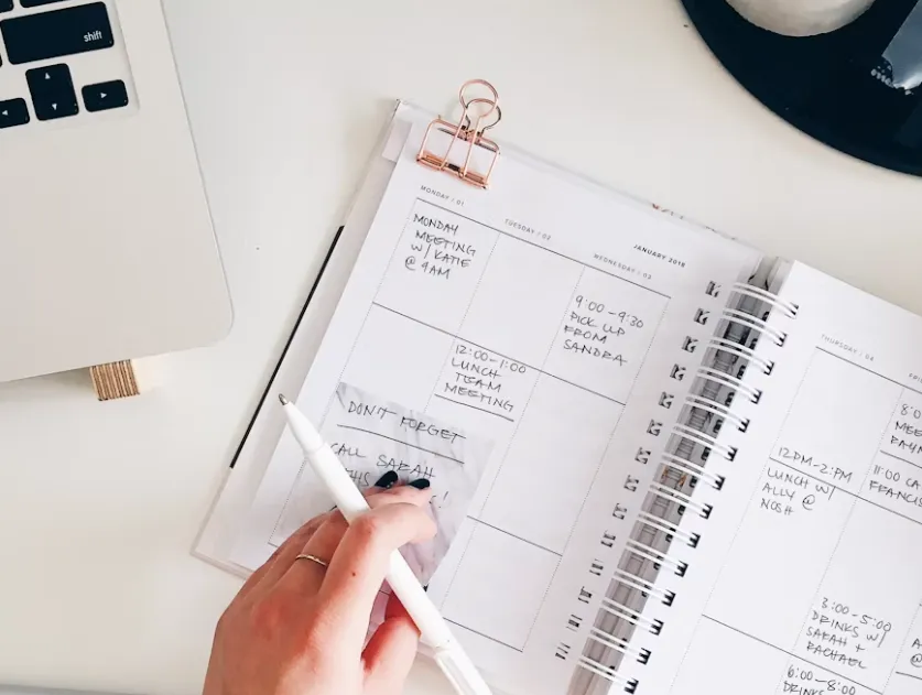 Virtual assistant working from home and planning agenda